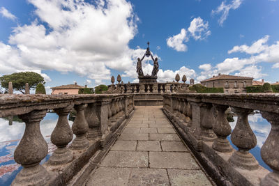 Statue of historic building against sky