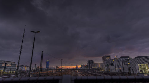 Illuminated cityscape against sky