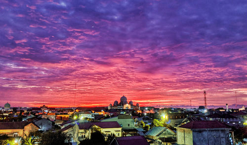 High angle view of illuminated buildings against sky
