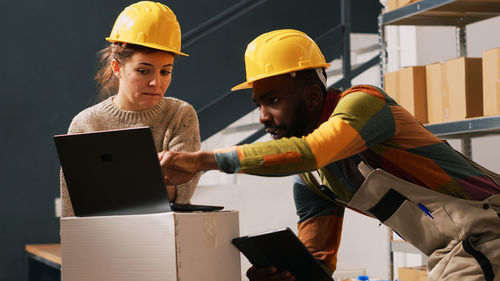 Rear view of man working at construction site