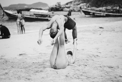 Full length of shirtless boy on beach