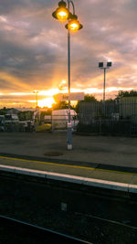 Street lights at airport during sunset