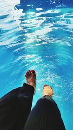 Low section of woman in swimming pool