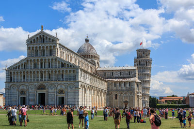 Group of people in front of historical building