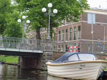 Boat by lake against trees