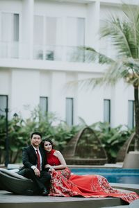 Couple sitting on a building