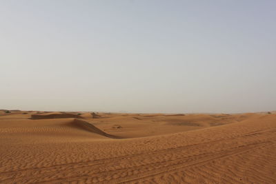 Scenic view of desert against clear sky