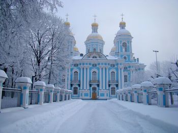 Snow covered road against st nicholas naval cathedral