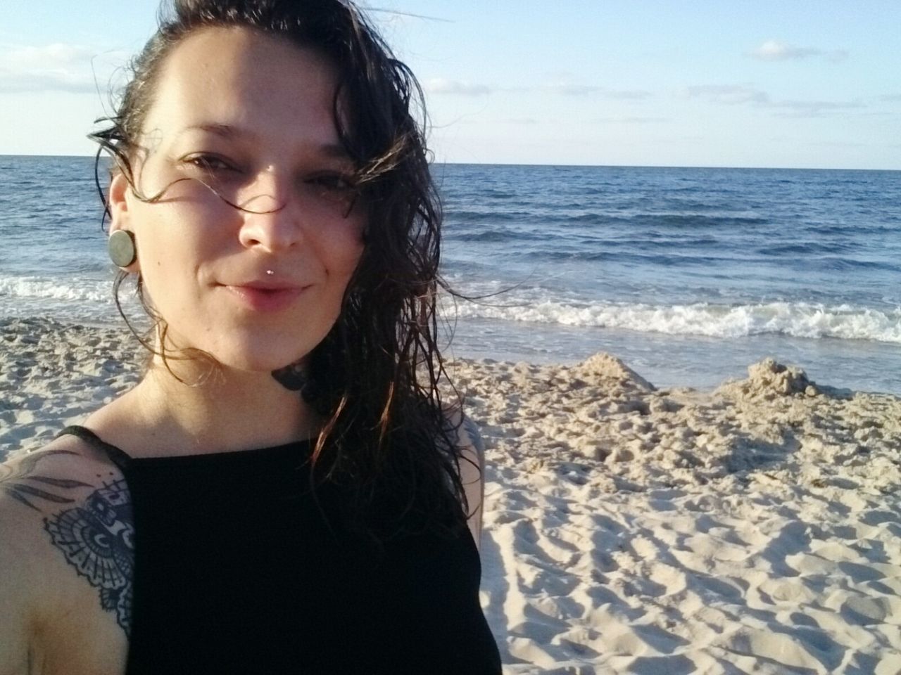 sea, beach, water, horizon over water, leisure activity, sand, lifestyles, headshot, vacations, young adult, long hair, sky, casual clothing, cloud, shore, wave, person, nature, scenics, tranquility, outdoors, weekend activities, summer, tranquil scene, beauty in nature