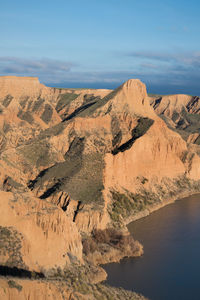 Scenic view of landscape and mountains against sky