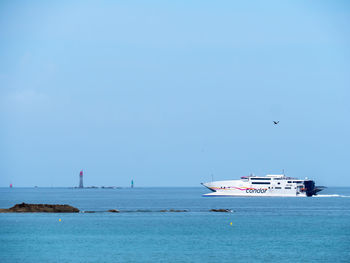 Ship sailing in sea against sky