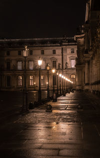 Low angle view of illuminated street at night