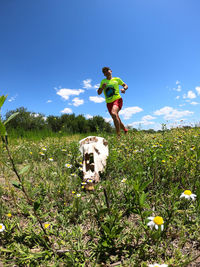 Full length of man on field against sky