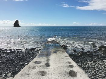 View of calm blue sea against the sky