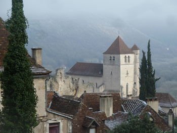 Houses and buildings against sky