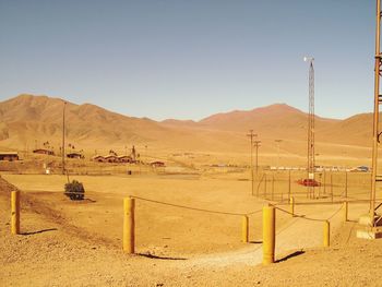 Scenic view of desert against clear sky