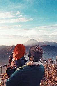 Scenic view of mountains against cloudy sky