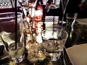 Close-up of wine glasses on table