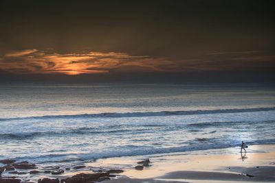 Scenic view of sea at sunset