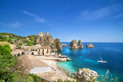 Panoramic view of sea against blue sky