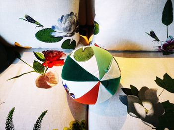 Close-up of multi colored flowers on table