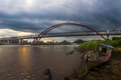 Bridge over river against sky