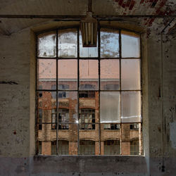 Closed window of abandoned house
