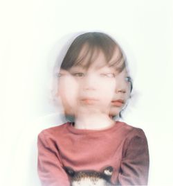 Multiple exposure of girl against wall