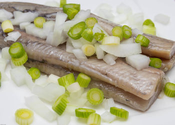 High angle view of chopped vegetables in plate on table