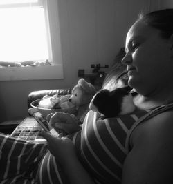 Close-up of woman sitting at home