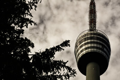 Low angle view of silhouette building against sky
