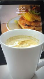 Close-up of served coffee cup on table