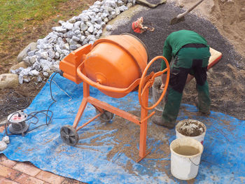 High angle view of man working at shore