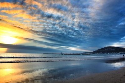 Scenic view of sea against cloudy sky