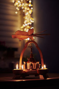 Illuminated lamp by building at night