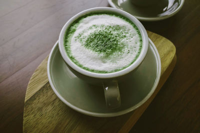 Matcha tea and bamboo matcha whisk.