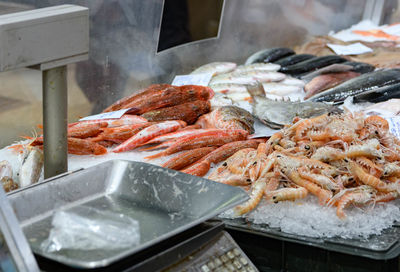 Closeup image of fish and seafood on ice at fish market.