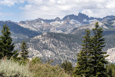 Scenic view of mountains against cloudy sky