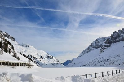 Scenic view of snowcapped mountains against sky