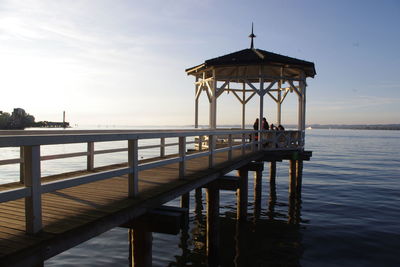 Pier over sea against sky