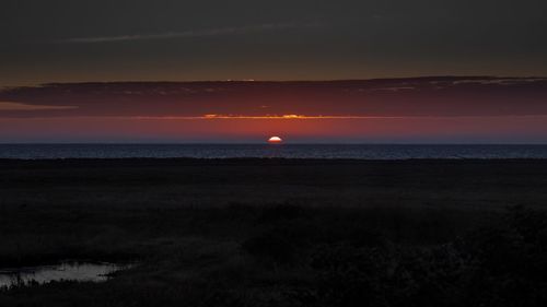 Scenic view of sea at sunset