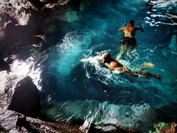 High angle view of man swimming in sea