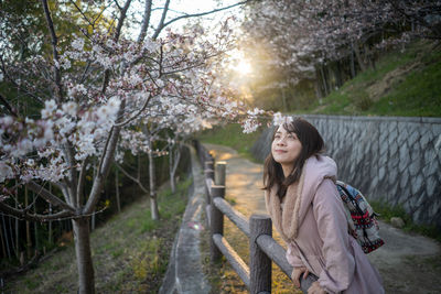 Woman looking at tree