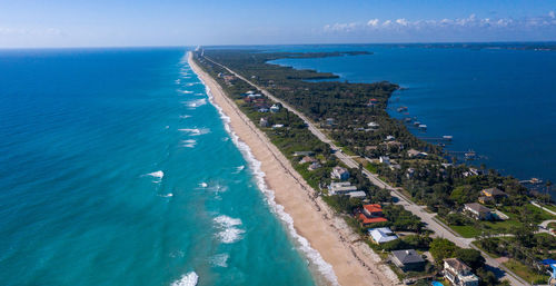 High angle view of sea against blue sky