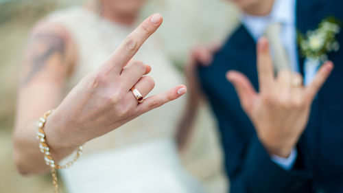 Close-up of couple holding hands