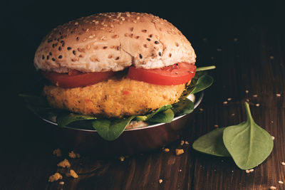 Close-up of burger on black background