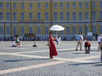 People walking on street in rain