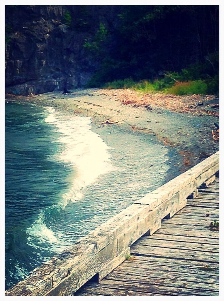 transfer print, water, auto post production filter, railing, tranquility, tranquil scene, nature, scenics, tree, beauty in nature, river, the way forward, pier, rippled, day, footbridge, outdoors, wood - material, rock - object, high angle view