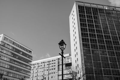 Low angle view of street light against building