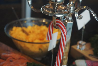 Close-up of candy cane and food